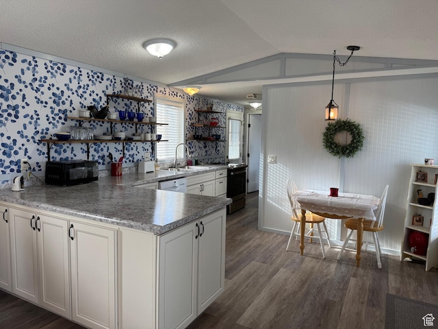 972 E Ridgeway Loop Unit 228, Garden City, UT 84028 - kitchen with open shelves, wallpapered walls, black microwave, a sink, and range