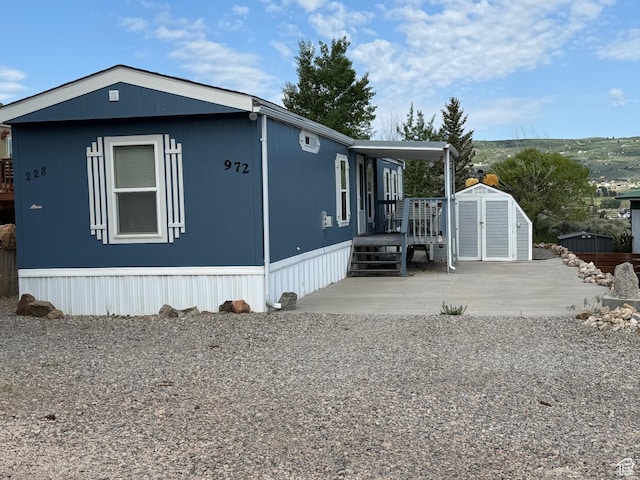 972 E Ridgeway Loop Unit 228, Garden City, UT 84028 - view of front of house featuring a patio area
