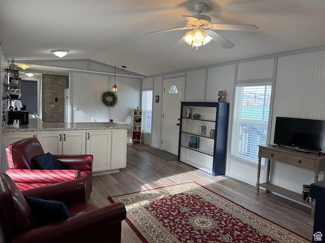 972 E Ridgeway Loop Unit 228, Garden City, UT 84028 - living area featuring a ceiling fan, vaulted ceiling, wood finished floors, and a textured ceiling