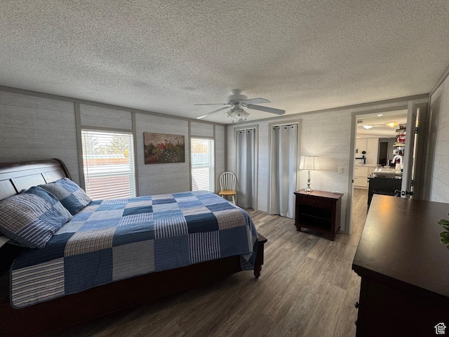 972 E Ridgeway Loop Unit 228, Garden City, UT 84028 - bedroom with wood finished floors, a textured ceiling, and ceiling fan