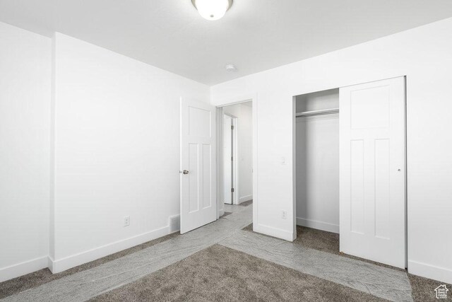 1151 W High Plains Dr Unit 605, Grantsville, UT 84029 - unfurnished bedroom with light carpet and a closet