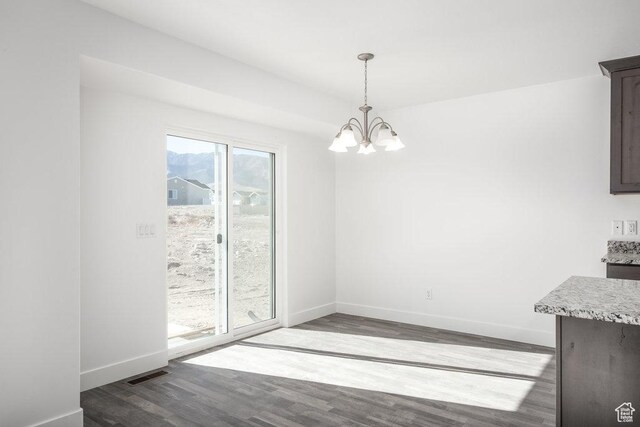 1151 W High Plains Dr Unit 605, Grantsville, UT 84029 - unfurnished dining area featuring hardwood / wood-style flooring and a notable chandelier