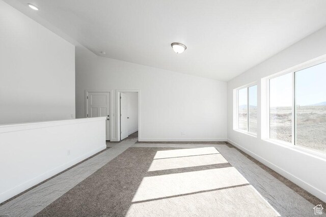 1151 W High Plains Dr Unit 605, Grantsville, UT 84029 - carpeted empty room with lofted ceiling