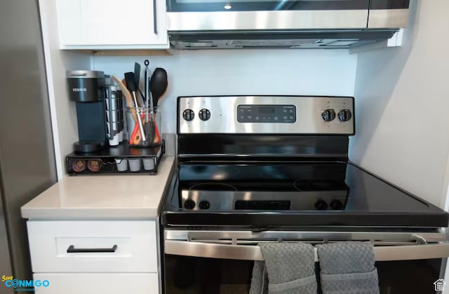 909 W Euclid Ave Unit 4, Salt Lake City, UT 84104 - kitchen with white cabinetry and stainless steel appliances