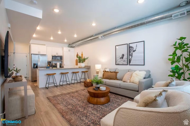 909 W Euclid Ave Unit 4, Salt Lake City, UT 84104 - living room featuring sink and light hardwood / wood-style floors