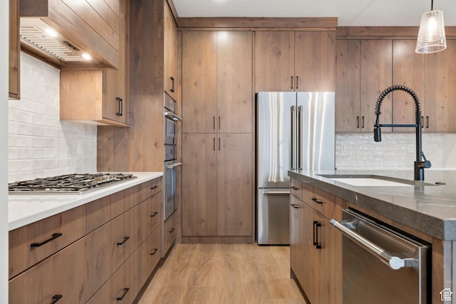 741 S 1800 W, Hurricane, UT 84737 - kitchen featuring dark stone counters, tasteful backsplash, stainless steel appliances, and a sink