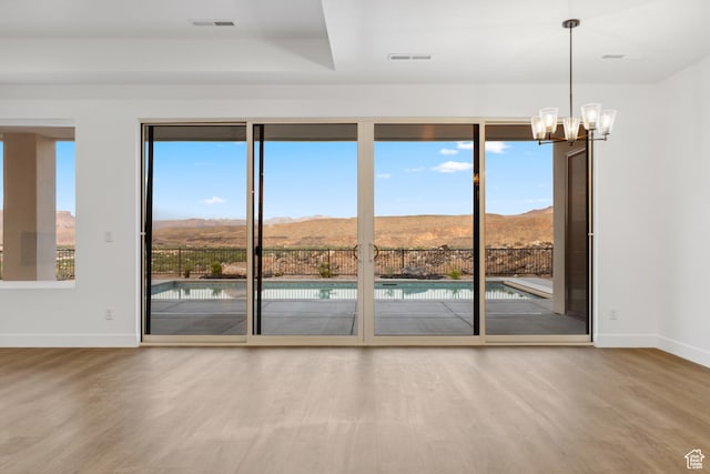 741 S 1800 W, Hurricane, UT 84737 - doorway with a mountain view, wood finished floors, and baseboards