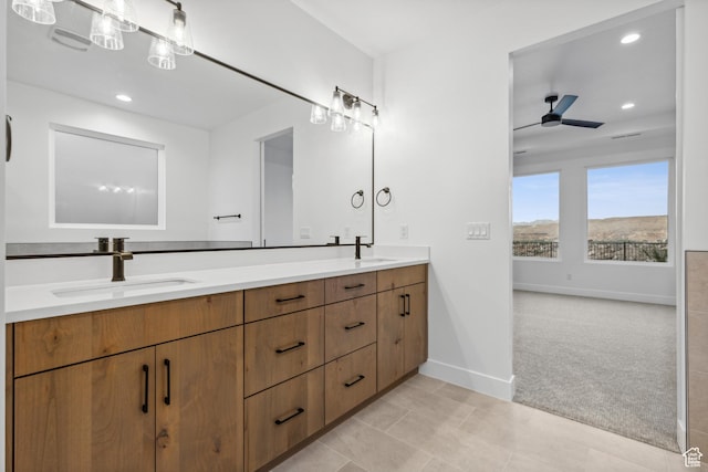 741 S 1800 W, Hurricane, UT 84737 - bathroom featuring baseboards, a ceiling fan, double vanity, and a sink