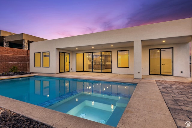 741 S 1800 W, Hurricane, UT 84737 - rear view of house with fence, a patio, an in ground hot tub, a fenced in pool, and stucco siding
