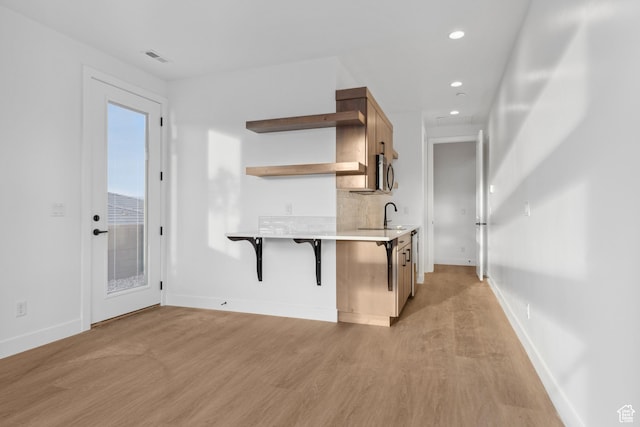 741 S 1800 W, Hurricane, UT 84737 - kitchen with open shelves, light countertops, baseboards, recessed lighting, and light wood finished floors