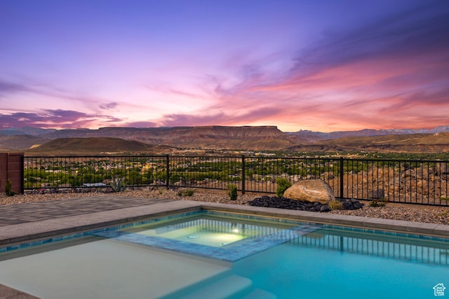 741 S 1800 W, Hurricane, UT 84737 - view of swimming pool featuring a mountain view, a fenced in pool, an in ground hot tub, and fence