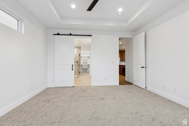 741 S 1800 W, Hurricane, UT 84737 - unfurnished bedroom with recessed lighting, a barn door, carpet flooring, baseboards, and a raised ceiling