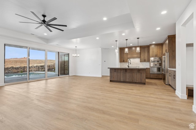 741 S 1800 W, Hurricane, UT 84737 - unfurnished living room featuring baseboards, recessed lighting, and a sink