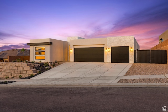 741 S 1800 W, Hurricane, UT 84737 - contemporary house featuring concrete driveway, stucco siding, an attached garage, and fence