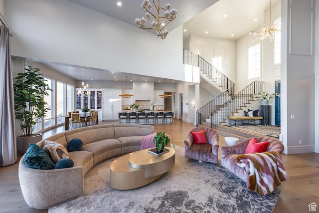 1515 E Bluff Point Dr, Draper, UT 84020 - living room with wood-type flooring, a high ceiling, and a wealth of natural light