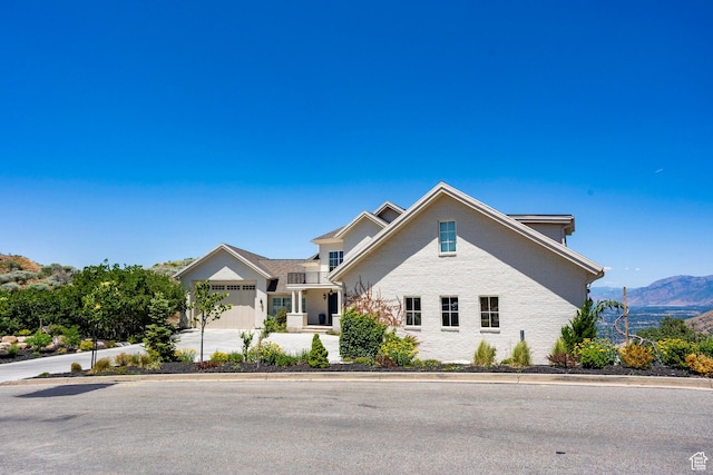 1515 E Bluff Point Dr, Draper, UT 84020 - traditional home featuring driveway, a mountain view, and brick siding