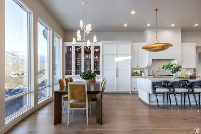 1515 E Bluff Point Dr, Draper, UT 84020 - dining room with wood-type flooring and an inviting chandelier