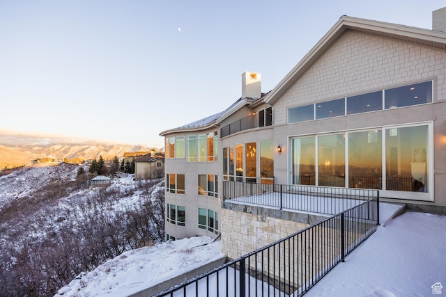 1515 E Bluff Point Dr, Draper, UT 84020 - snow covered property featuring a chimney and a balcony