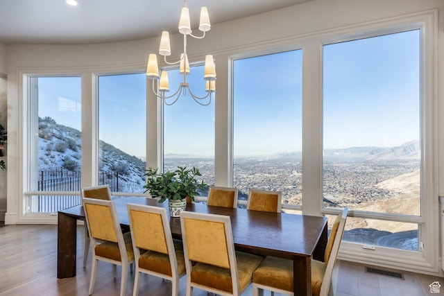 1515 E Bluff Point Dr, Draper, UT 84020 - dining space featuring a wealth of natural light, hardwood / wood-style floors, and a mountain view