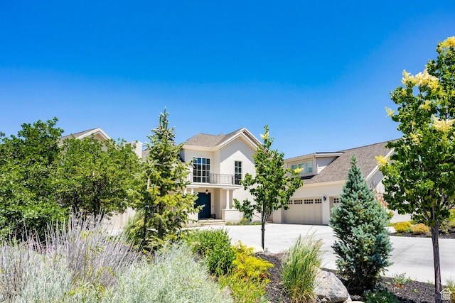 1515 E Bluff Point Dr, Draper, UT 84020 - view of front of property featuring driveway, a balcony, and an attached garage
