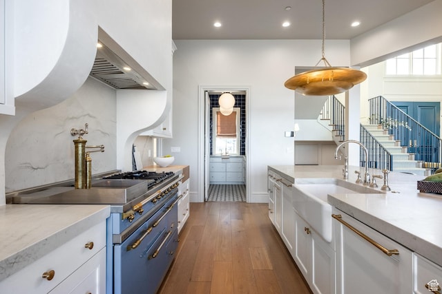 1515 E Bluff Point Dr, Draper, UT 84020 - kitchen featuring wall chimney exhaust hood, white cabinetry, wood-type flooring, recessed lighting, and pendant lighting