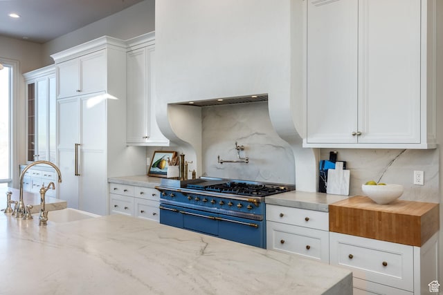 1515 E Bluff Point Dr, Draper, UT 84020 - kitchen featuring stainless steel range, sink, and white cabinets