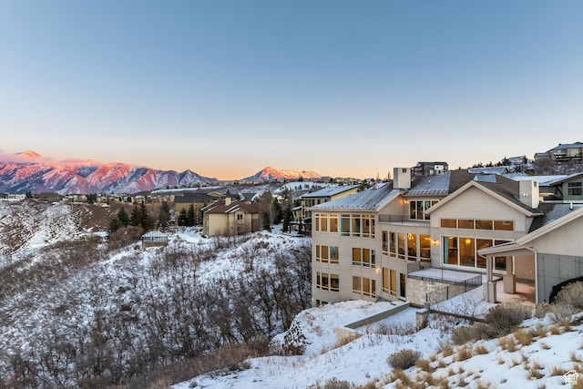 1515 E Bluff Point Dr, Draper, UT 84020 - snow covered rear of property with a sunroom, a mountain view, and a shed