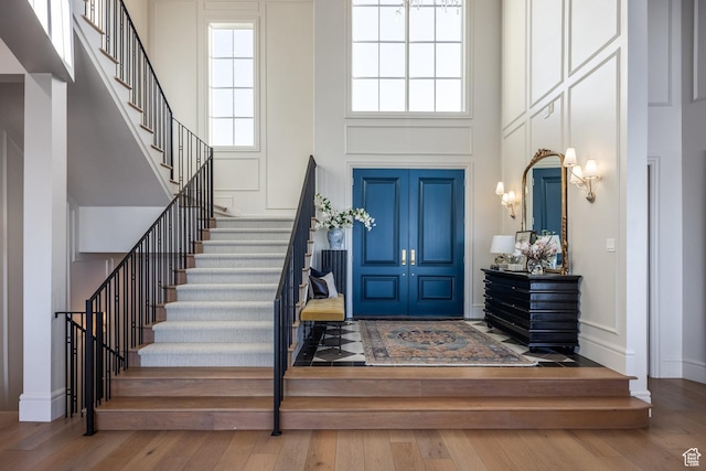 1515 E Bluff Point Dr, Draper, UT 84020 - entryway featuring wood-type flooring and a towering ceiling