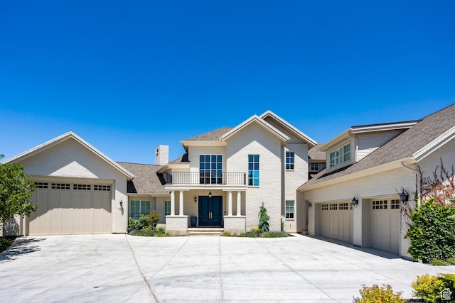 1515 E Bluff Point Dr, Draper, UT 84020 - view of front facade featuring driveway, a porch, and a chimney