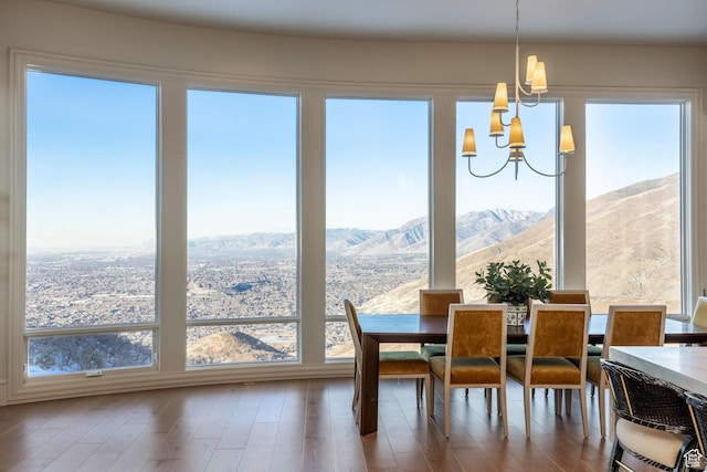 1515 E Bluff Point Dr, Draper, UT 84020 - dining room with a mountain view, hardwood / wood-style flooring, an inviting chandelier, and a wealth of natural light