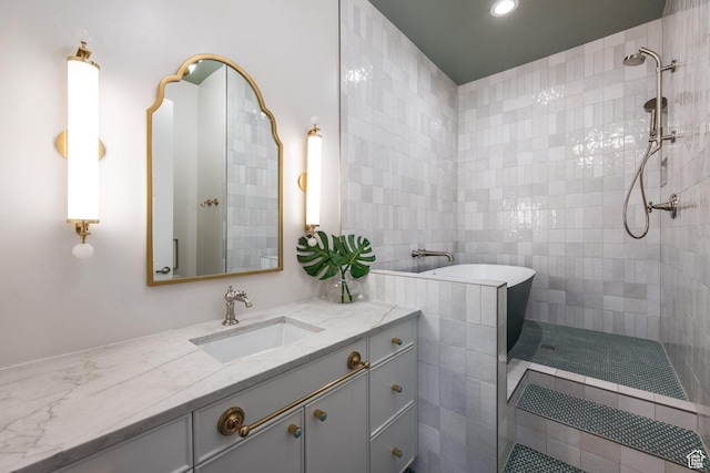 1515 E Bluff Point Dr, Draper, UT 84020 - bathroom featuring tiled shower, vanity, and tile walls