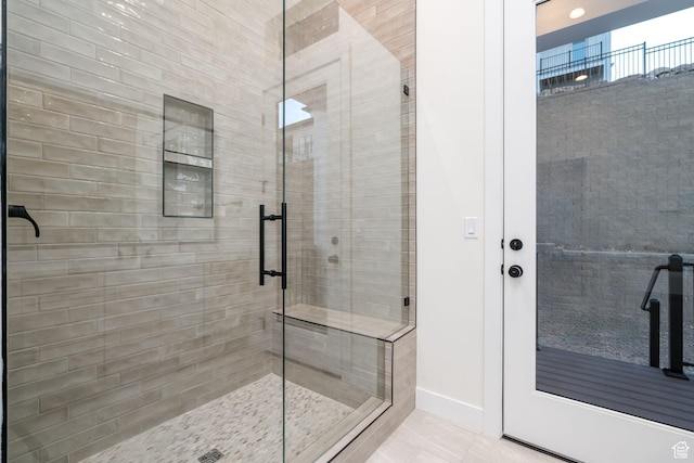 bathroom with tile patterned floors and walk in shower