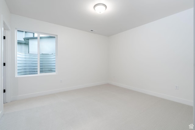 carpeted empty room with plenty of natural light