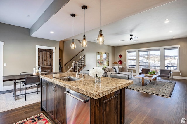1773 E Longview Dr, Hideout, UT 84036 - kitchen with dark hardwood / wood-style flooring, dark brown cabinets, hanging light fixtures, and a center island with sink