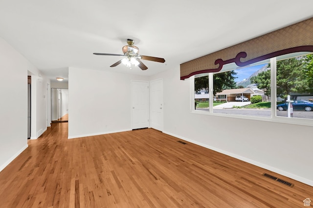 967 E 2800 N, North Ogden, UT 84414 - unfurnished room with baseboards, wood finished floors, and a ceiling fan