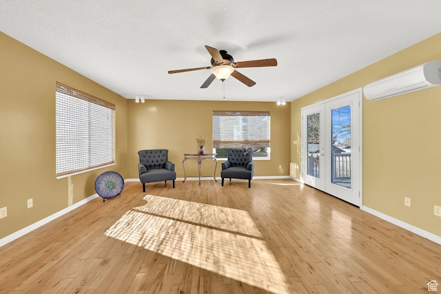 967 E 2800 N, North Ogden, UT 84414 - sitting room with baseboards, light wood-type flooring, a wall unit AC, and a ceiling fan