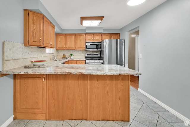 967 E 2800 N, North Ogden, UT 84414 - kitchen with a sink, light stone counters, tasteful backsplash, and appliances with stainless steel finishes