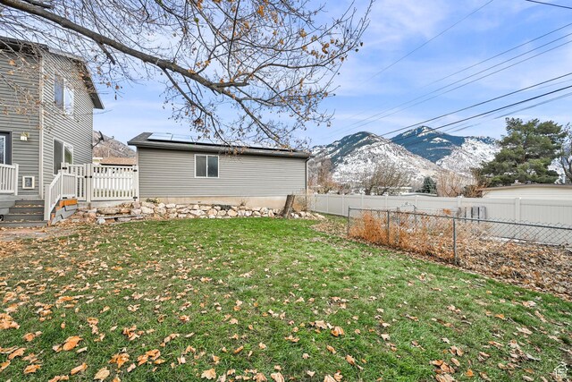 967 E 2800 N, North Ogden, UT 84414 - view of yard with a fenced backyard and a deck with mountain view