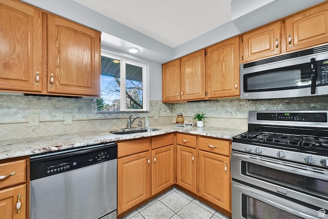 967 E 2800 N, North Ogden, UT 84414 - kitchen with tasteful backsplash, light tile patterned floors, a sink, light stone counters, and appliances with stainless steel finishes