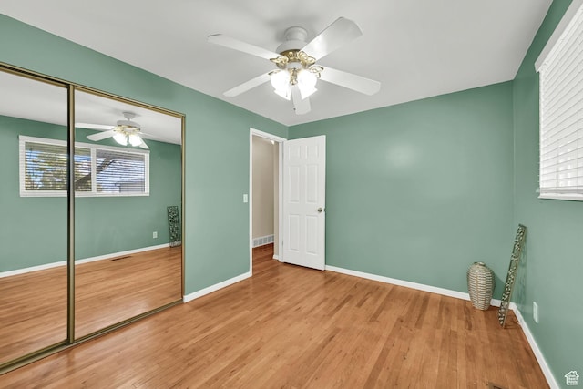 967 E 2800 N, North Ogden, UT 84414 - unfurnished bedroom with a ceiling fan, baseboards, a closet, and wood finished floors
