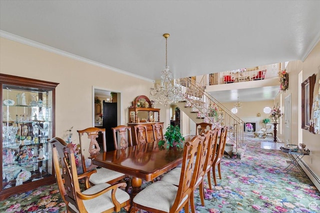 dining area featuring crown molding and a notable chandelier