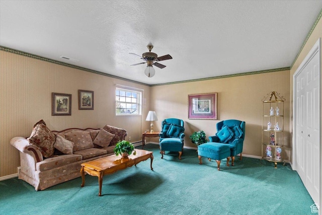 carpeted living room featuring a textured ceiling, baseboard heating, ceiling fan, and ornamental molding