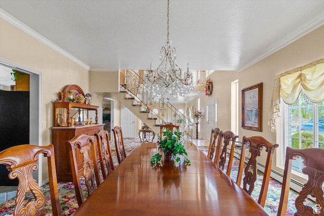 dining room featuring a chandelier, a baseboard heating unit, and crown molding