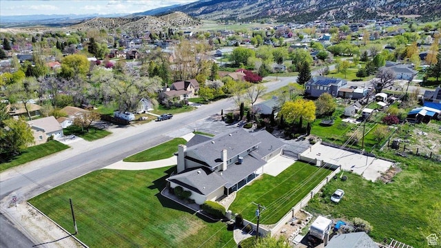 birds eye view of property with a mountain view