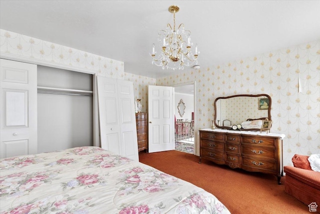 carpeted bedroom featuring a closet and an inviting chandelier