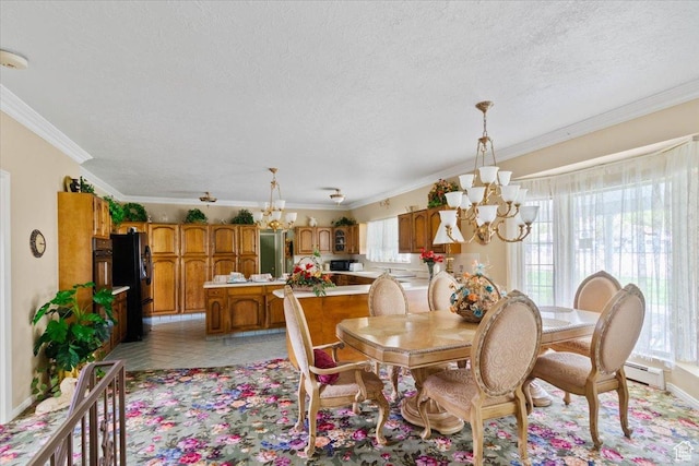 tiled dining space featuring a chandelier, ornamental molding, a textured ceiling, and a baseboard heating unit
