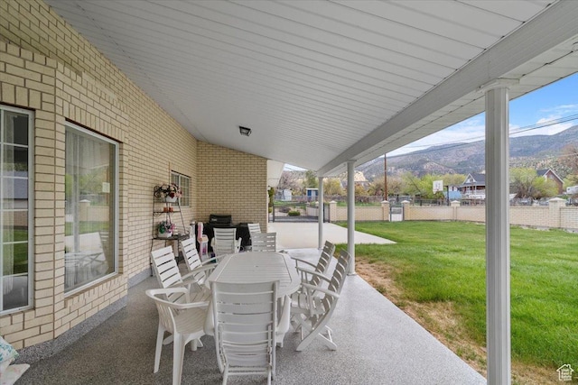 view of patio / terrace with a mountain view