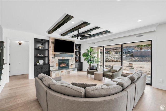 4009 S 2420 E, St George, UT 84790 - living room with a ceiling fan, light wood-style floors, recessed lighting, a stone fireplace, and built in shelves
