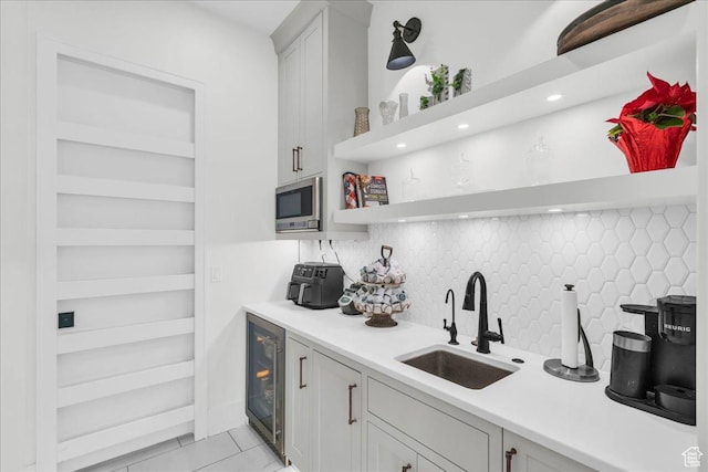 4009 S 2420 E, St George, UT 84790 - kitchen featuring wine cooler, open shelves, backsplash, light countertops, and stainless steel microwave