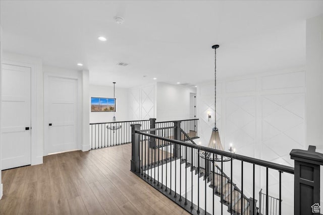 4009 S 2420 E, St George, UT 84790 - hallway featuring an upstairs landing, a chandelier, wood finished floors, and recessed lighting